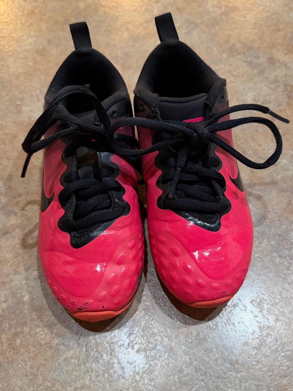 Little girls pink and black Nike cleats. Size 12c
